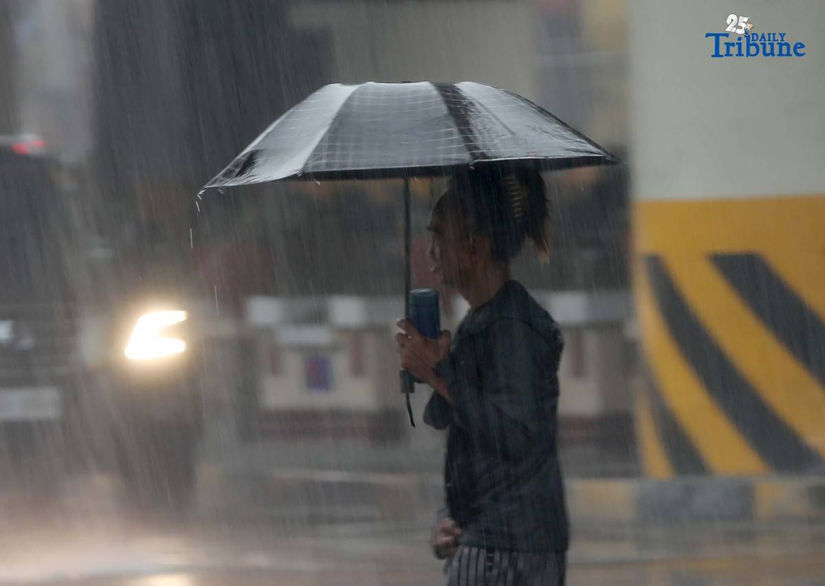 Commuters are braving the downpour with umbrellas and raincoats along EDSA in Quezon City. PAGASA says a shear line is affecting parts of Northern and Central Luzon.