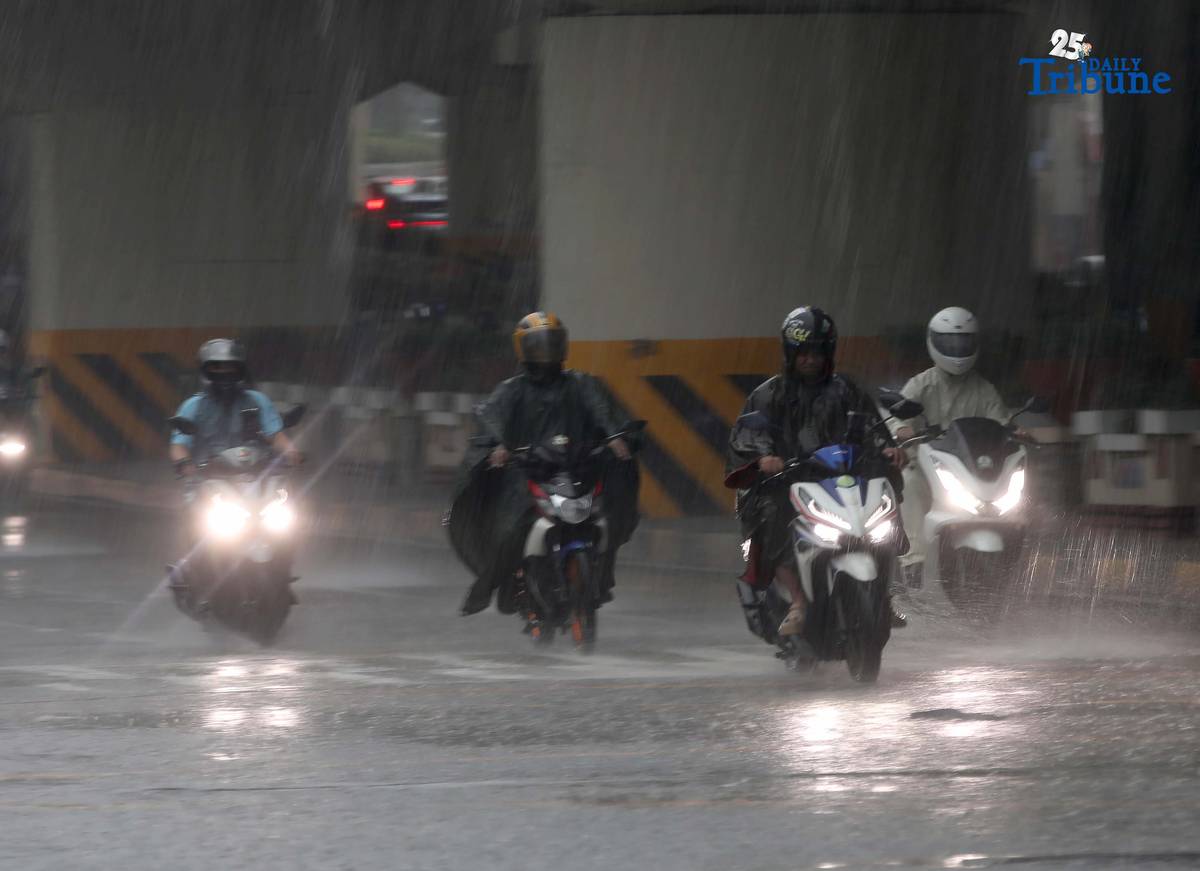 Commuters are braving the downpour with umbrellas and raincoats along EDSA in Quezon City. PAGASA says a shear line is affecting parts of Northern and Central Luzon.