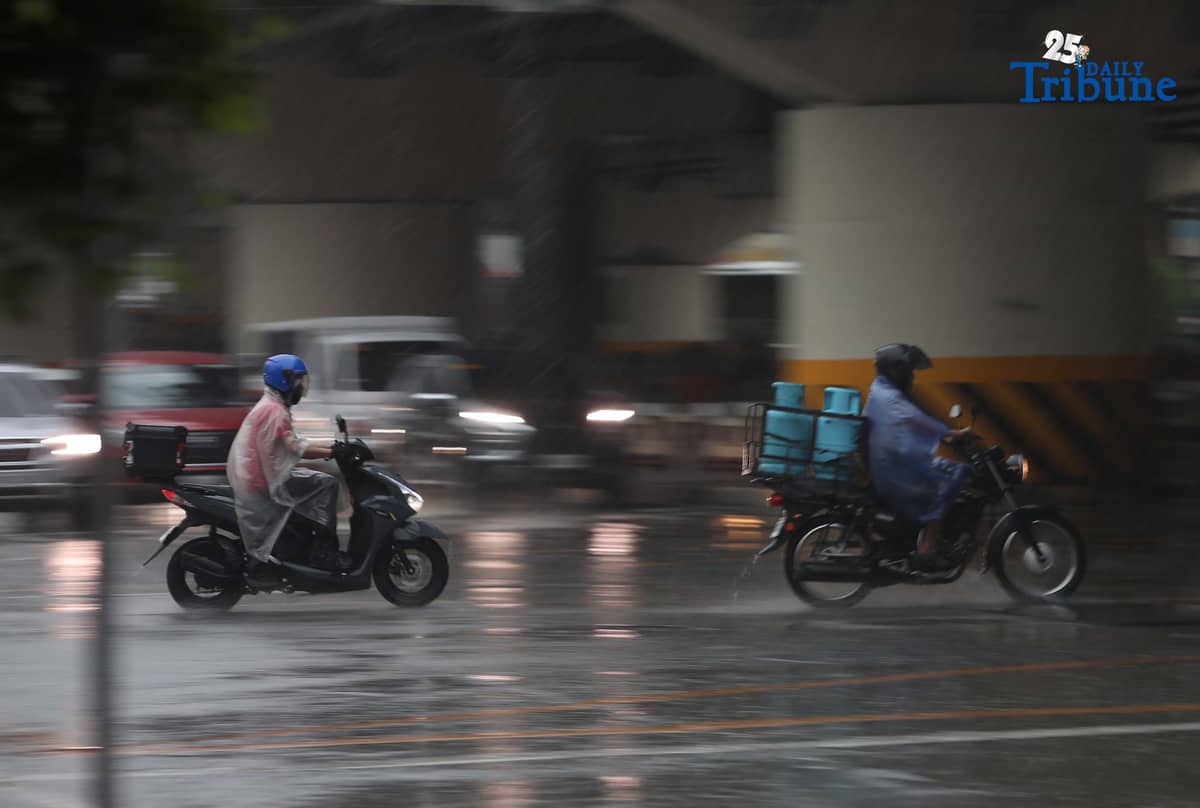 Commuters are braving the downpour with umbrellas and raincoats along EDSA in Quezon City. PAGASA says a shear line is affecting parts of Northern and Central Luzon.