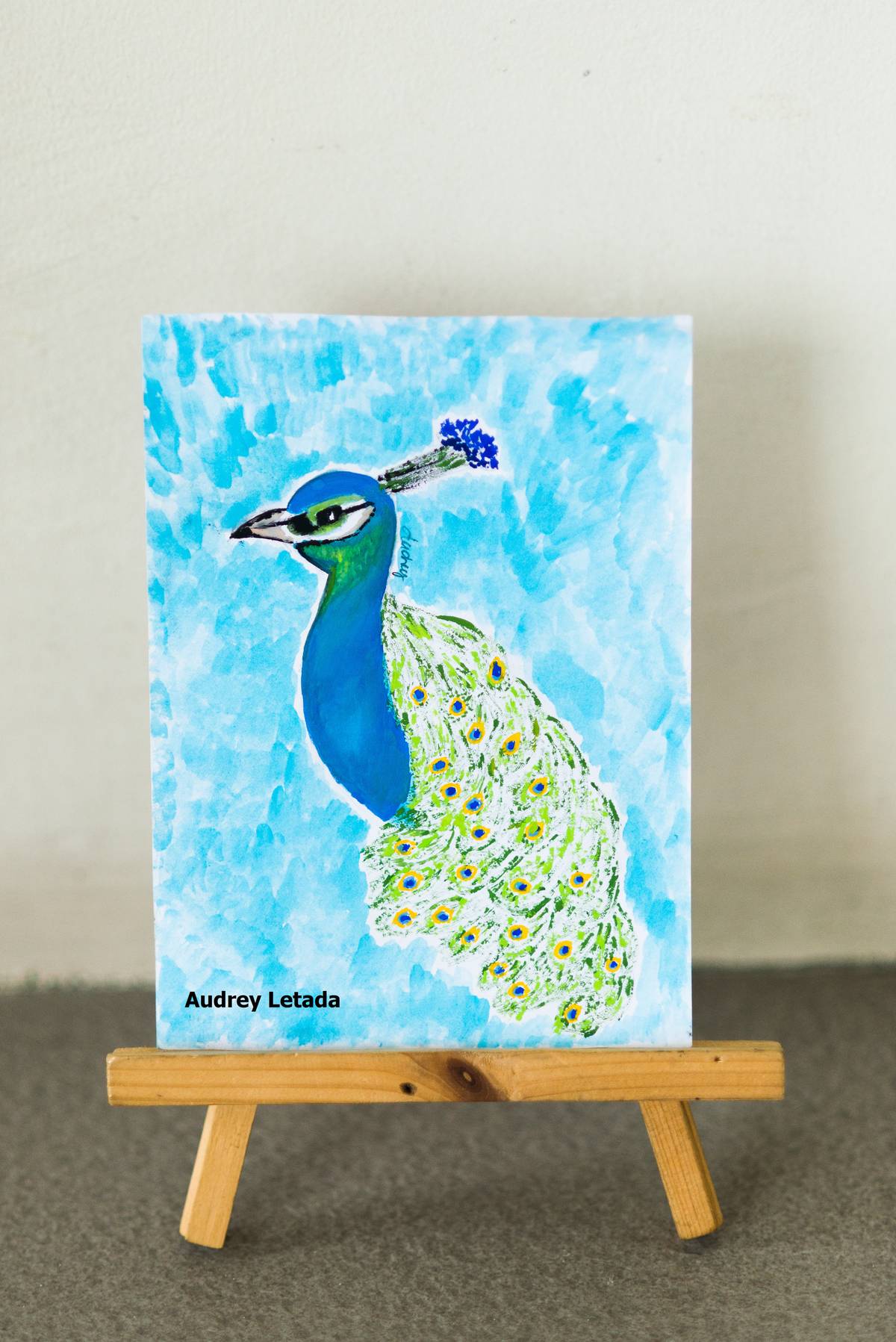 A peacock painting by the designer.