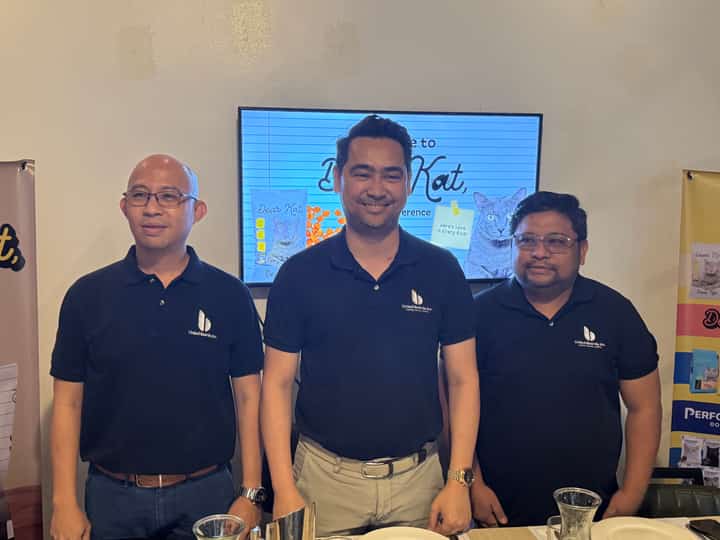 Julius Ladica, Douglas Baarde, Jr., and Wilson Samoranos are the three executives of United Baarde, Inc., at the launching of Dear Kat cat food.