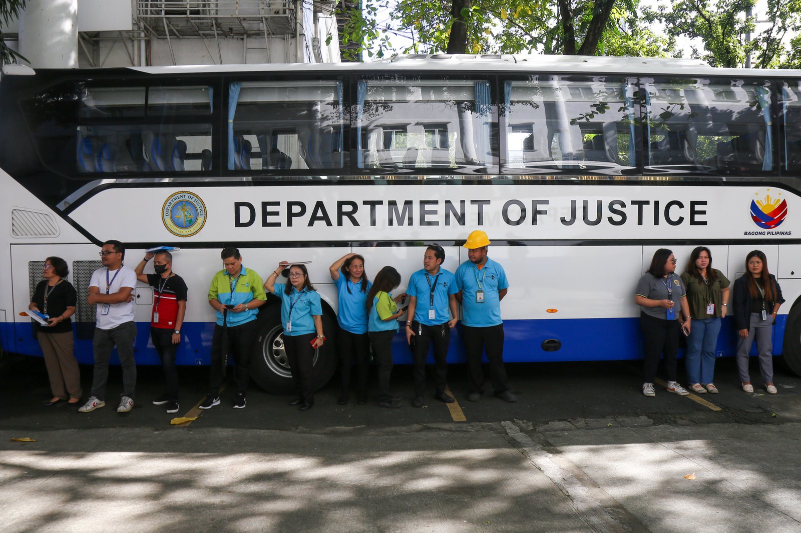 Department of Justice personnel evacuate to the open parking area during the Nationwide Simultaneous Earthquake Drill (NSED) at Padre Faura, Manila, on Thursday morning, 06 November 2025. The drill aims to raise public awareness and strengthen preparedness for potential earthquakes.