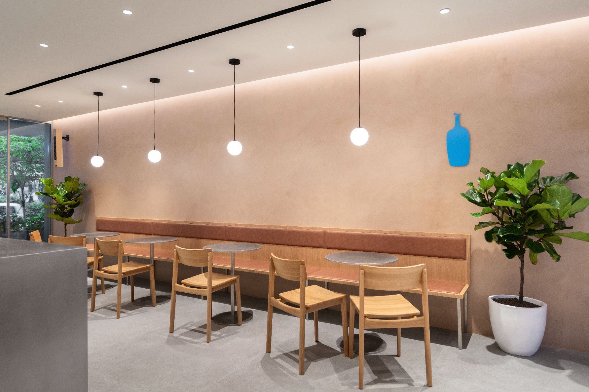 A variety of furniture from 2-top tables and benches to a large community table ensures there is a seat for everyone at Blue Bottle Paragon Cafe.