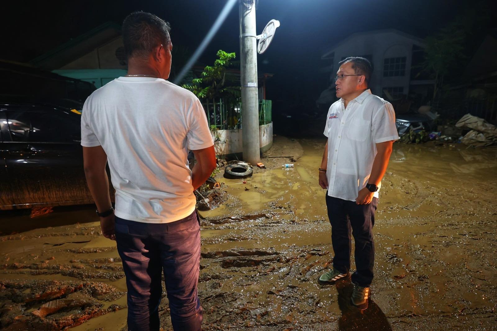 Go urges stronger support for urban poor as he checks on typhoon victims