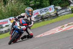 CHARGING out of the bend, Onahon shows smooth control on his way to another strong lap.