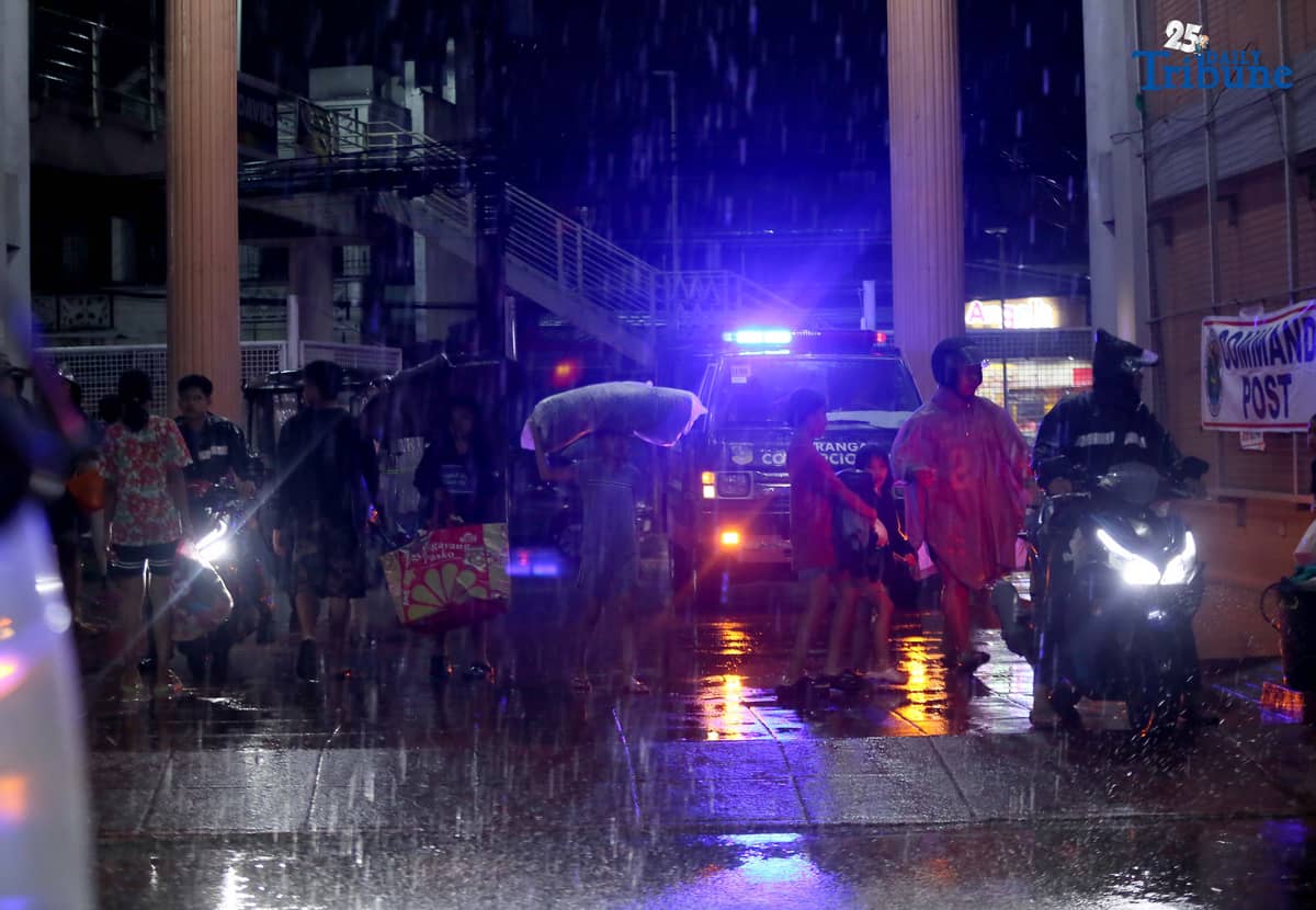Residents living near the Marikina River arrive at H. Bautista Elementary School in Marikina City after evacuating their homes on 9 November 2025, as a preemptive measure ordered by the local government ahead of Super Typhoon Uwan.