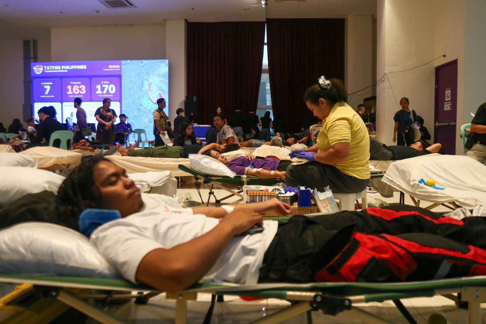 As Super Typhoon Uwan approaches, hundreds of rescue and fire volunteers still found time to donate blood at Ongpin Tower in Manila on the morning of 9 November 2025, in anticipation of a critical rise in blood demand, especially for trauma and emergency cases.