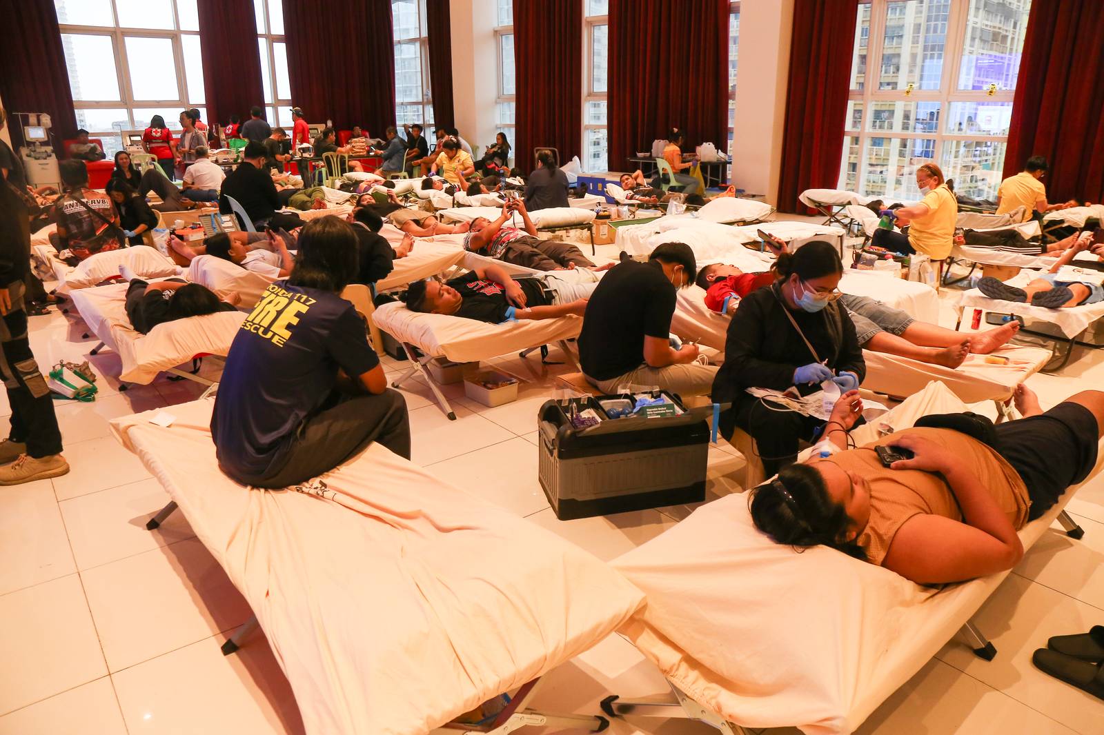 As Super Typhoon Uwan approaches, hundreds of rescue and fire volunteers still found time to donate blood at Ongpin Tower in Manila on the morning of 9 November 2025, in anticipation of a critical rise in blood demand, especially for trauma and emergency cases.