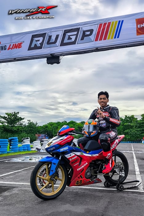 CELEBRATING the championship, Onahon poses with his Honda Winner X after securing the RUGP overall title.