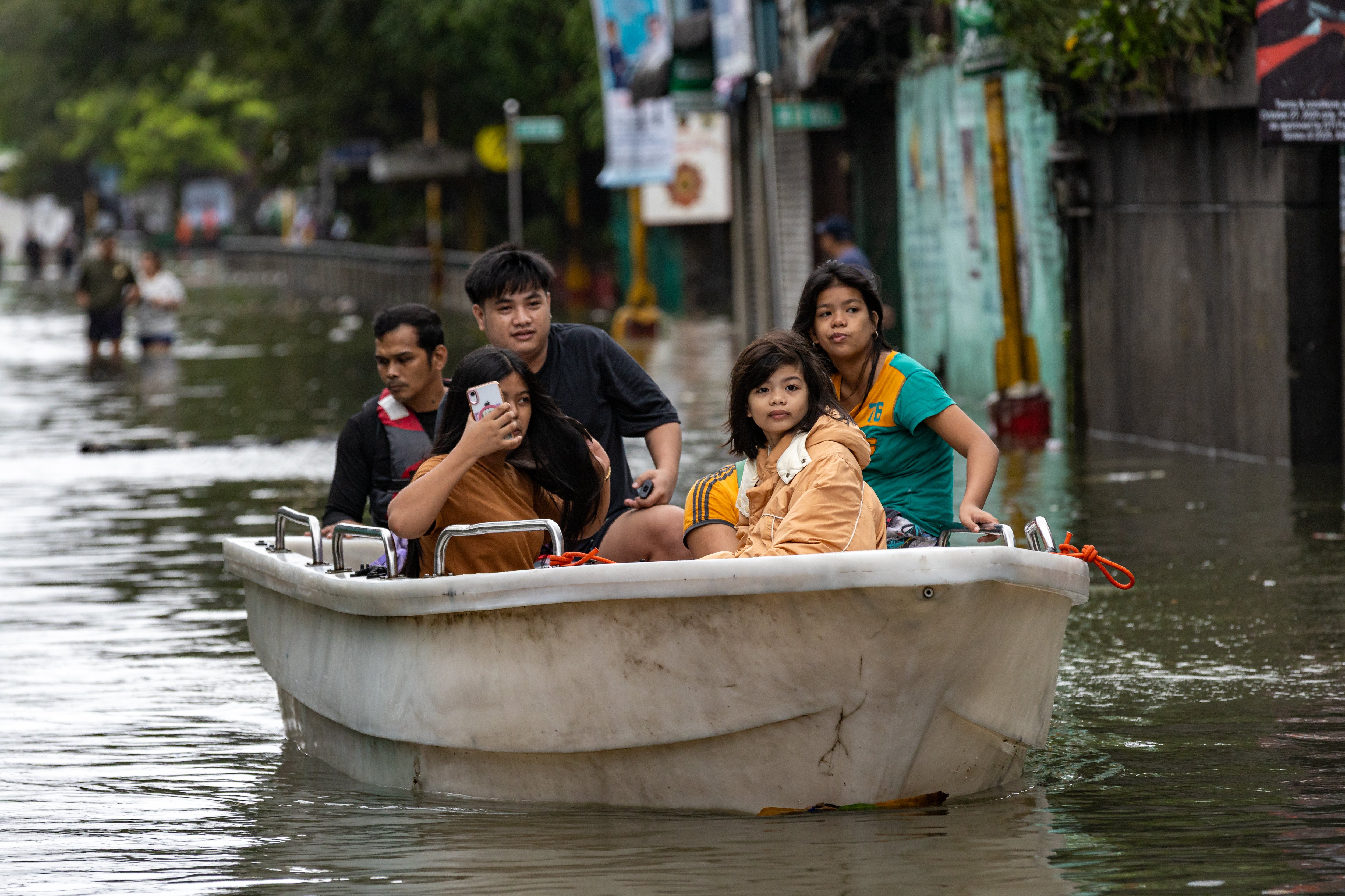 Floodwaters submerge Navotas as storm surge overwhelms river gate