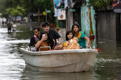 Floodwaters submerge Navotas as storm surge overwhelms river gate
