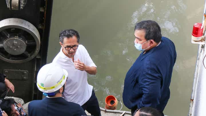 Department of Public Works and Highways Secretary Vince Dizon (left) leads the inspection of Estero de Paco Pumping Station in Manila on Tuesday after its floodgate was damaged during the height of Super Typhoon Uwan.