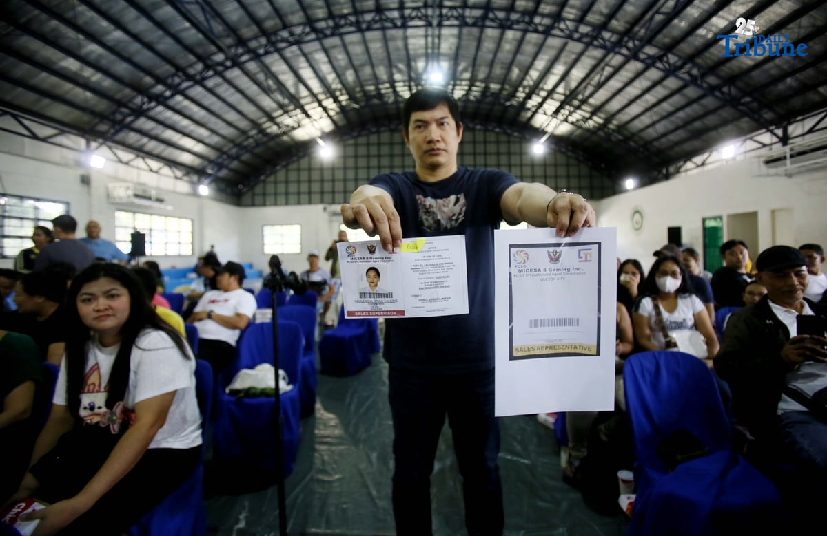 Carlos Montemayor, owner of Micesa 8 Gaming Inc., meets with Small Town Lottery (STL) agents at Camp Karingal in Quezon City, presenting samples of genuine versus fake STL identification cards. Montemayor and STL officials urged closer coordination with local authorities and the police to curb illegal number games such as “jueteng,” and reaffirmed full compliance with PCSO rules to safeguard bettors and STL players.