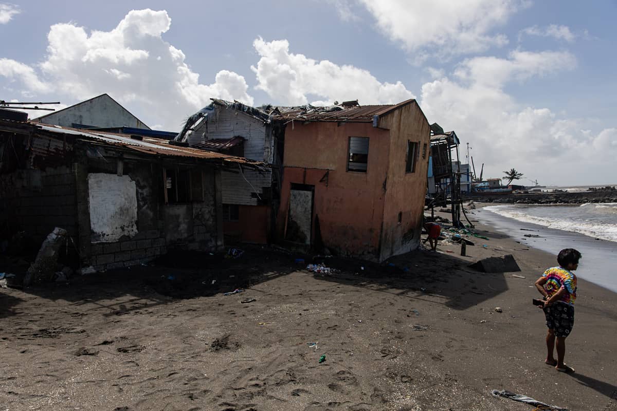 Super Typhoon Uwan's devastation caused this house to tilt in the coastal barangay Amaya V in Tanza, Cavite on Tuesday.
