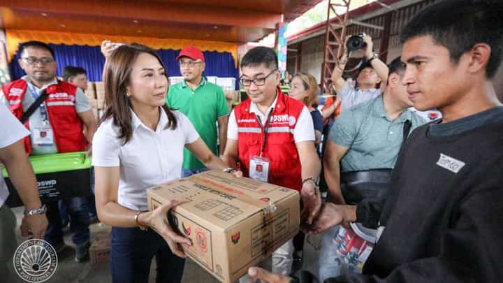 Tourism Secretary Christina Garcia Frasco on Tuesday distributes relief packs to residents of the Moises Padilla municipality, one of the hardest-hit by typhoon ‘Tino’ in Negros Occidental.