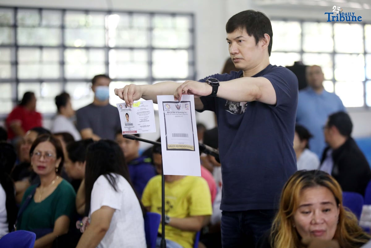 Carlos Montemayor, owner of Micesa 8 Gaming Inc., meets with Small Town Lottery (STL) agents at Camp Karingal in Quezon City, presenting samples of genuine versus fake STL identification cards. Montemayor and STL officials urged closer coordination with local authorities and the police to curb illegal number games such as “jueteng,” and reaffirmed full compliance with PCSO rules to safeguard bettors and STL players.