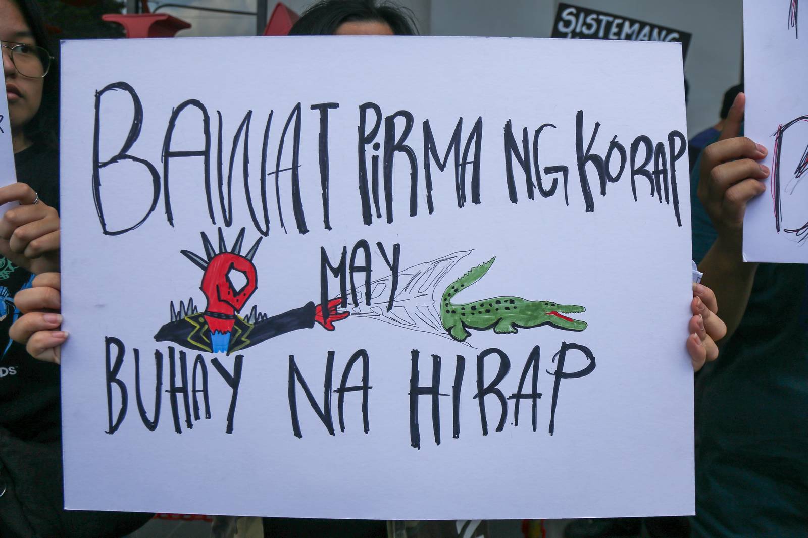 Students from Mapua University in Makati gather outside their campus in Pablo Ocampo Sr. Extension on 13 November 2025 as they call for justice and accountability from all officials and contractors involved in corruption.