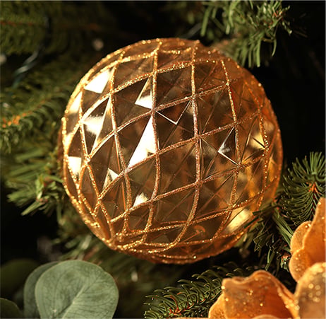 Gold glittered sphere Christmas ball.