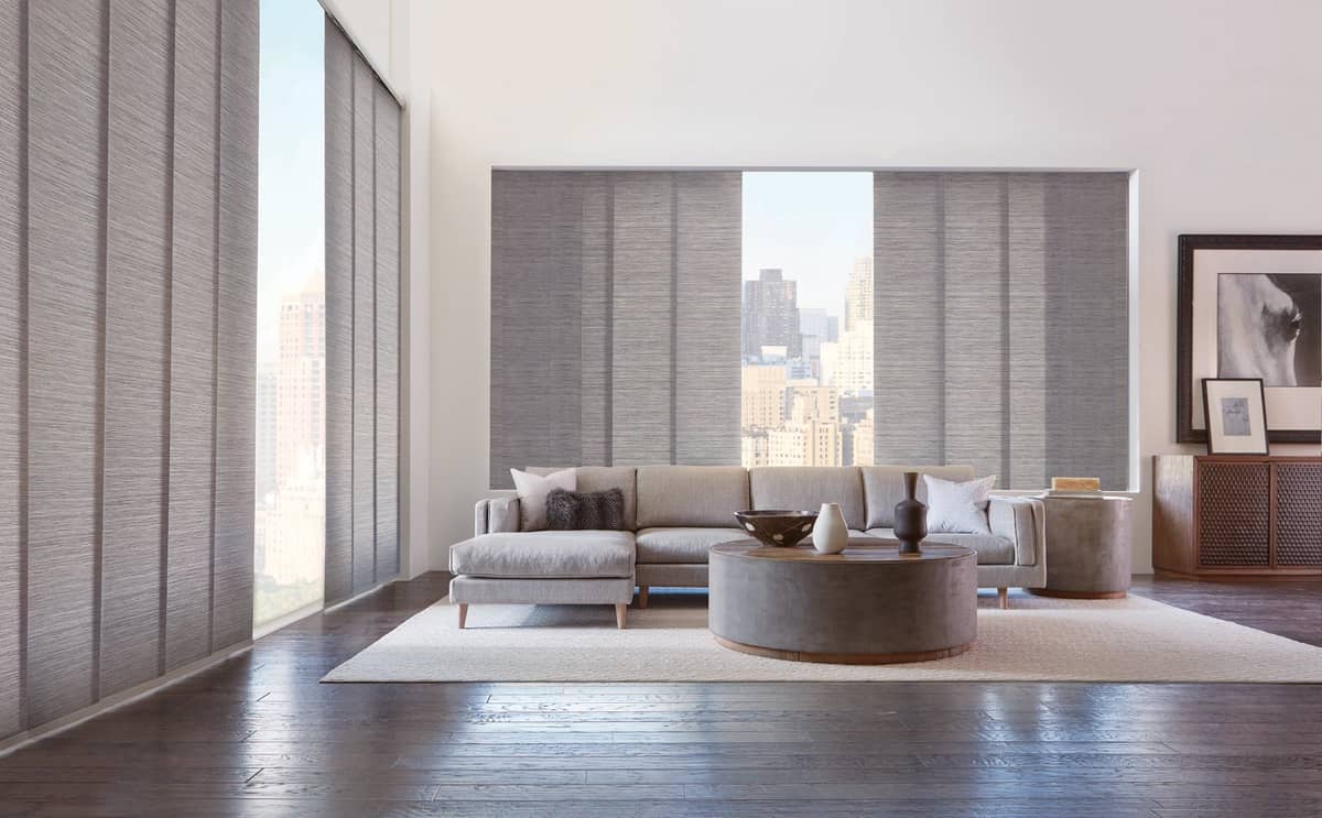 Bring contemporary style and smooth movement to your home with Hunter Douglas Skyline Gliding Window Panels.