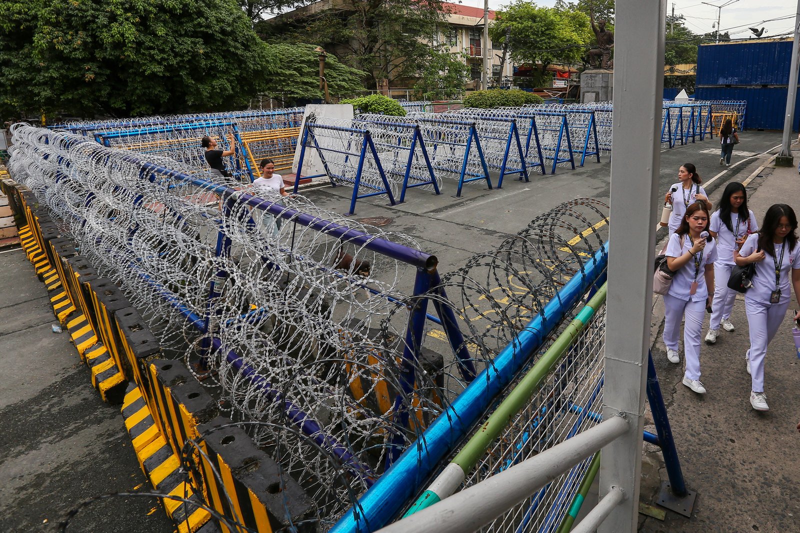 Police personnel install razor wires, concrete barriers, and container vans in various streets leading towards Malacañang compound in Manila on 15 November 2025, in preparation for the upcoming anti-corruption protests.

The following streets, General Solano, Nicanor Padilla, Arlegui, and Mendiola, are no longer accessible to motorists.