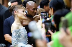Man charged after rushing Ariana Grande in Singapore