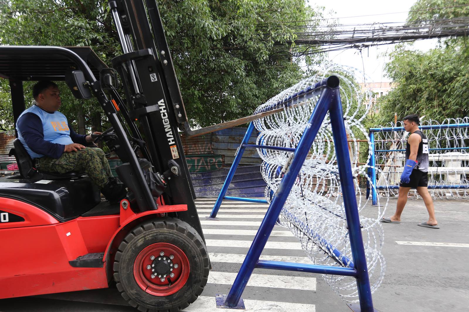 Police personnel install razor wires, concrete barriers, and container vans in various streets leading towards Malacañang compound in Manila on 15 November 2025, in preparation for the upcoming anti-corruption protests.

The following streets, General Solano, Nicanor Padilla, Arlegui, and Mendiola, are no longer accessible to motorists.