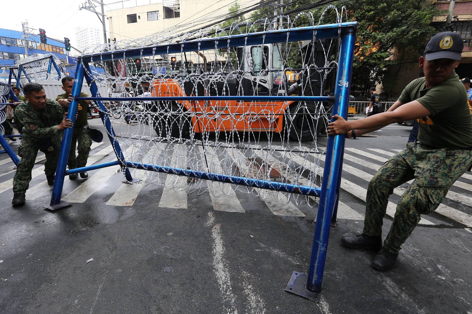 Police personnel install razor wires, concrete barriers, and container vans in various streets leading towards Malacañang compound in Manila on 15 November 2025, in preparation for the upcoming anti-corruption protests.

The following streets, General Solano, Nicanor Padilla, Arlegui, and Mendiola, are no longer accessible to motorists.