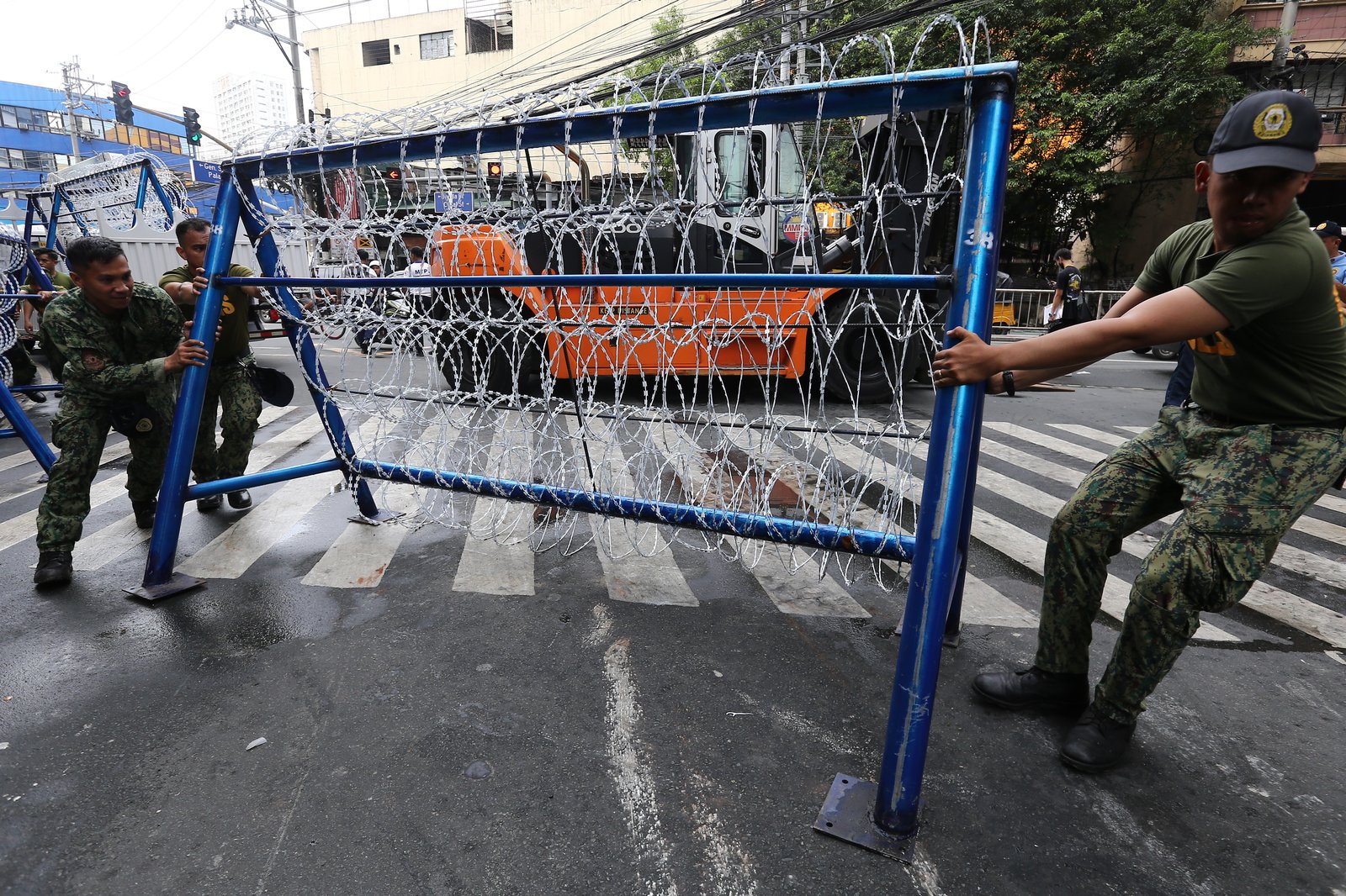 Police personnel install razor wires, concrete barriers, and container vans in various streets leading towards Malacañang compound in Manila on 15 November 2025, in preparation for the upcoming anti-corruption protests.

The following streets, General Solano, Nicanor Padilla, Arlegui, and Mendiola, are no longer accessible to motorists.