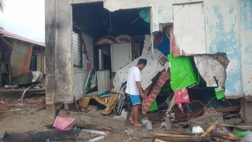 A man inspects the damage after Uwan in Romblon.