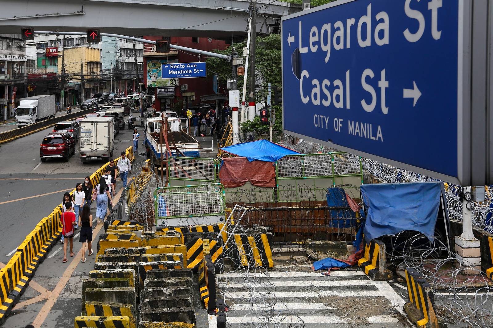 Police personnel install razor wires, concrete barriers, and container vans in various streets leading towards Malacañang compound in Manila on 15 November 2025, in preparation for the upcoming anti-corruption protests.

The following streets, General Solano, Nicanor Padilla, Arlegui, and Mendiola, are no longer accessible to motorists.