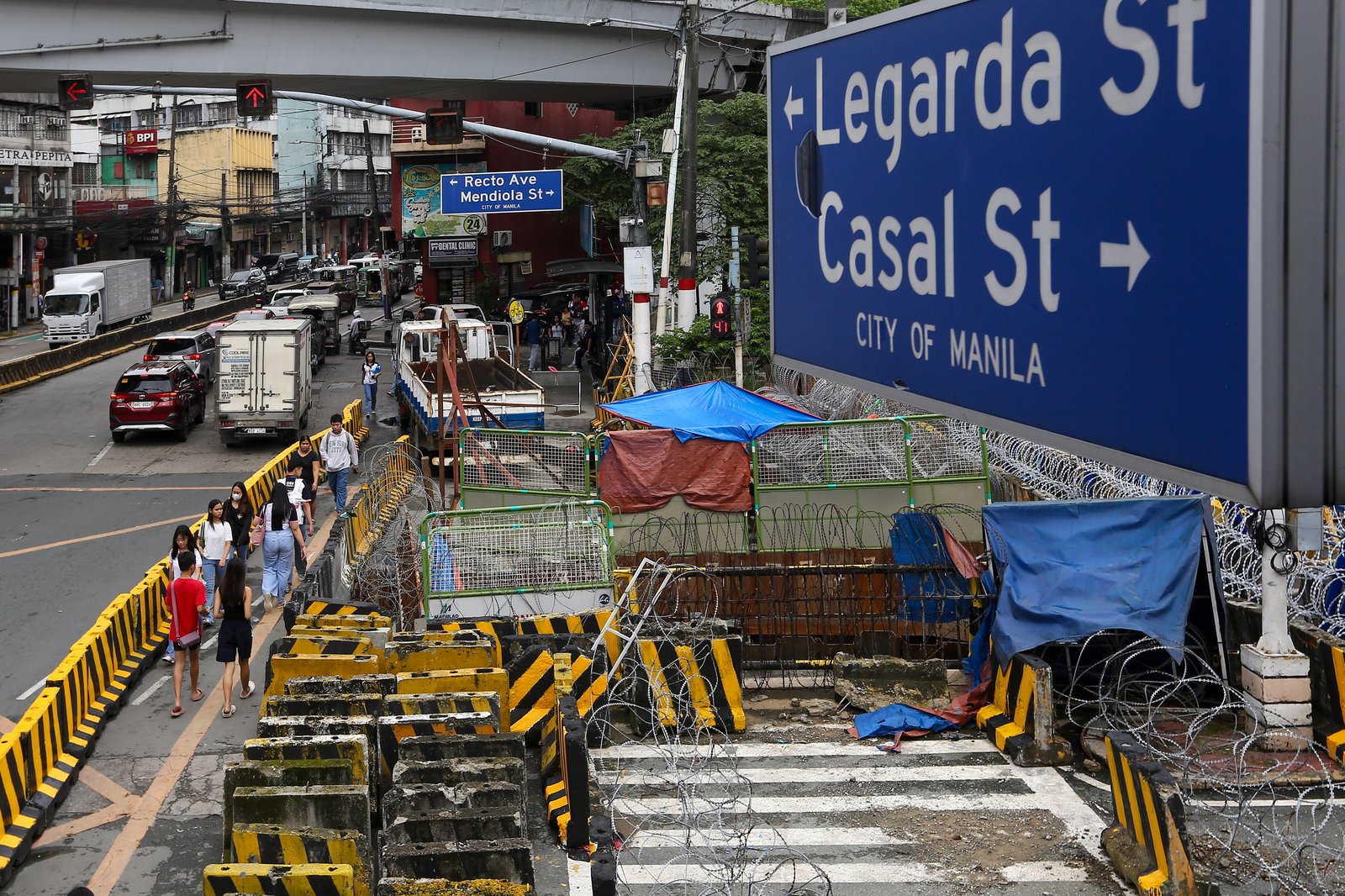 Police personnel install razor wires, concrete barriers, and container vans in various streets leading towards Malacañang compound in Manila on 15 November 2025, in preparation for the upcoming anti-corruption protests.

The following streets, General Solano, Nicanor Padilla, Arlegui, and Mendiola, are no longer accessible to motorists.