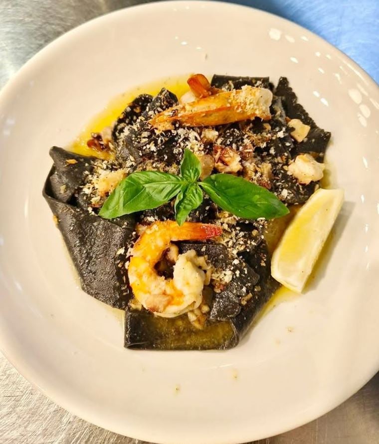 Pappardelle black ink with prawns and octopus.
