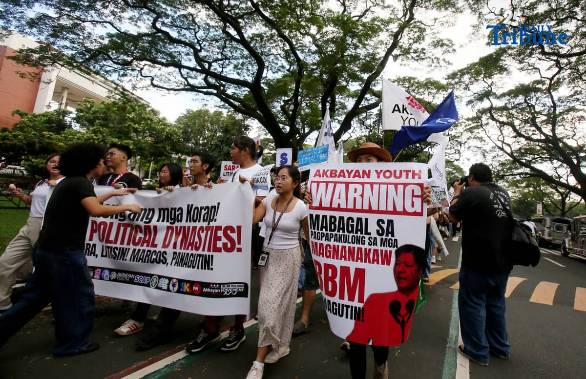 Student Youth Against Kurakot members march around the University of the Philippines–Diliman academic oval in celebration of International Students’ Day, holding placards bearing a symbolic “guilty verdict” against government officials linked to the flood control scandal. The youth group called for accountability and reforms as they staged their protest on campus in Quezon City on Monday.
