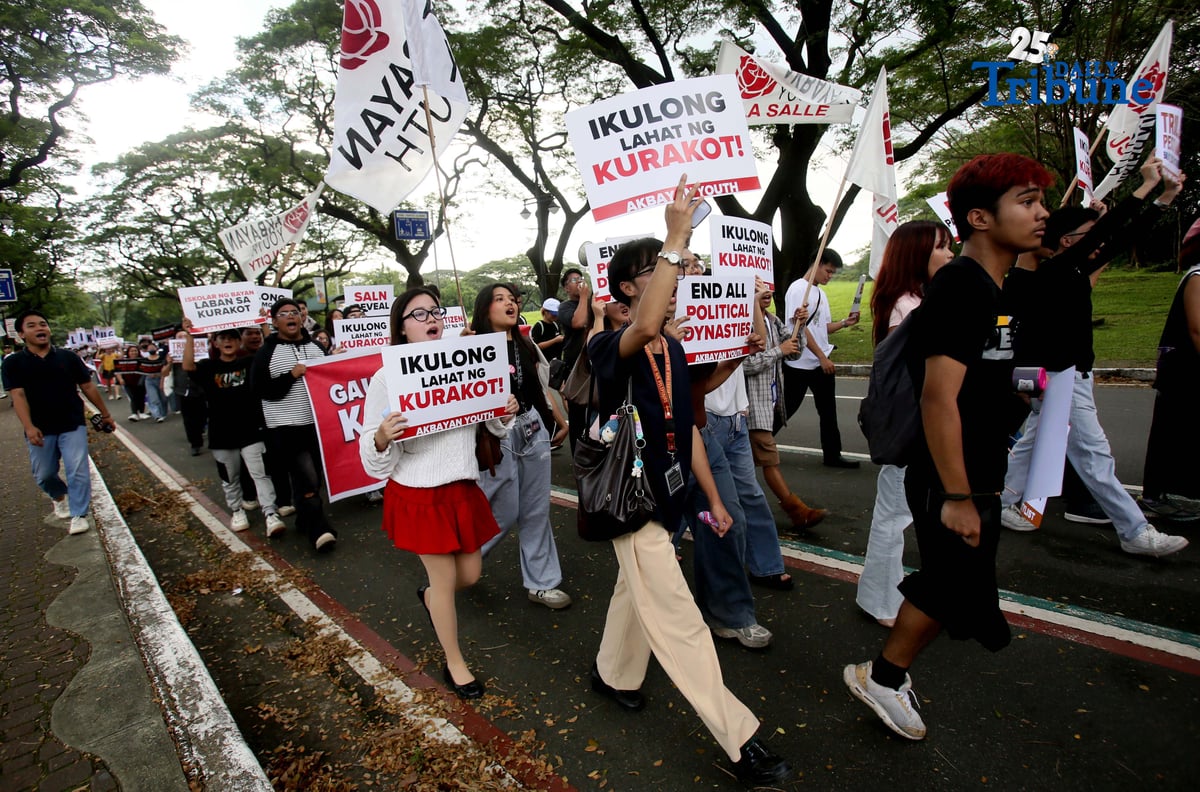 Student Youth Against Kurakot members march around the University of the Philippines–Diliman academic oval in celebration of International Students’ Day, holding placards bearing a symbolic “guilty verdict” against government officials linked to the flood control scandal. The youth group called for accountability and reforms as they staged their protest on campus in Quezon City on Monday.