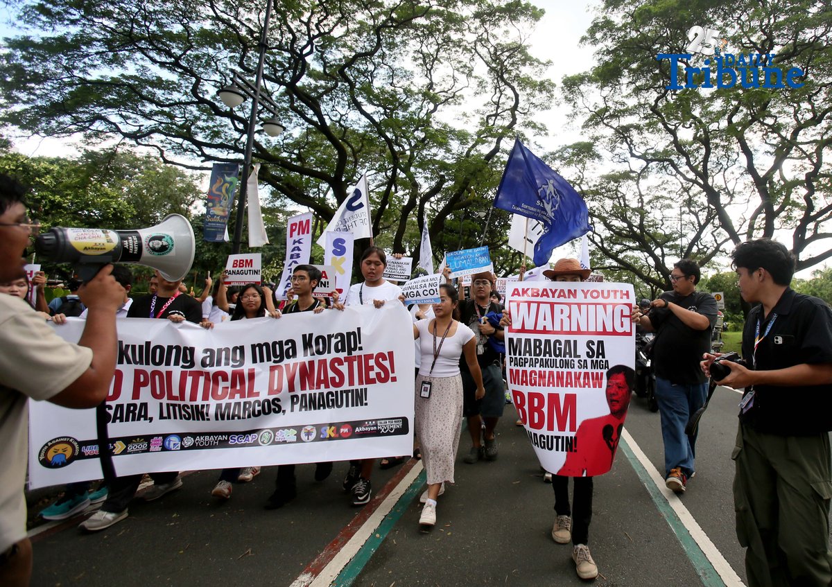Student Youth Against Kurakot members march around the University of the Philippines–Diliman academic oval in celebration of International Students’ Day, holding placards bearing a symbolic “guilty verdict” against government officials linked to the flood control scandal. The youth group called for accountability and reforms as they staged their protest on campus in Quezon City on Monday.