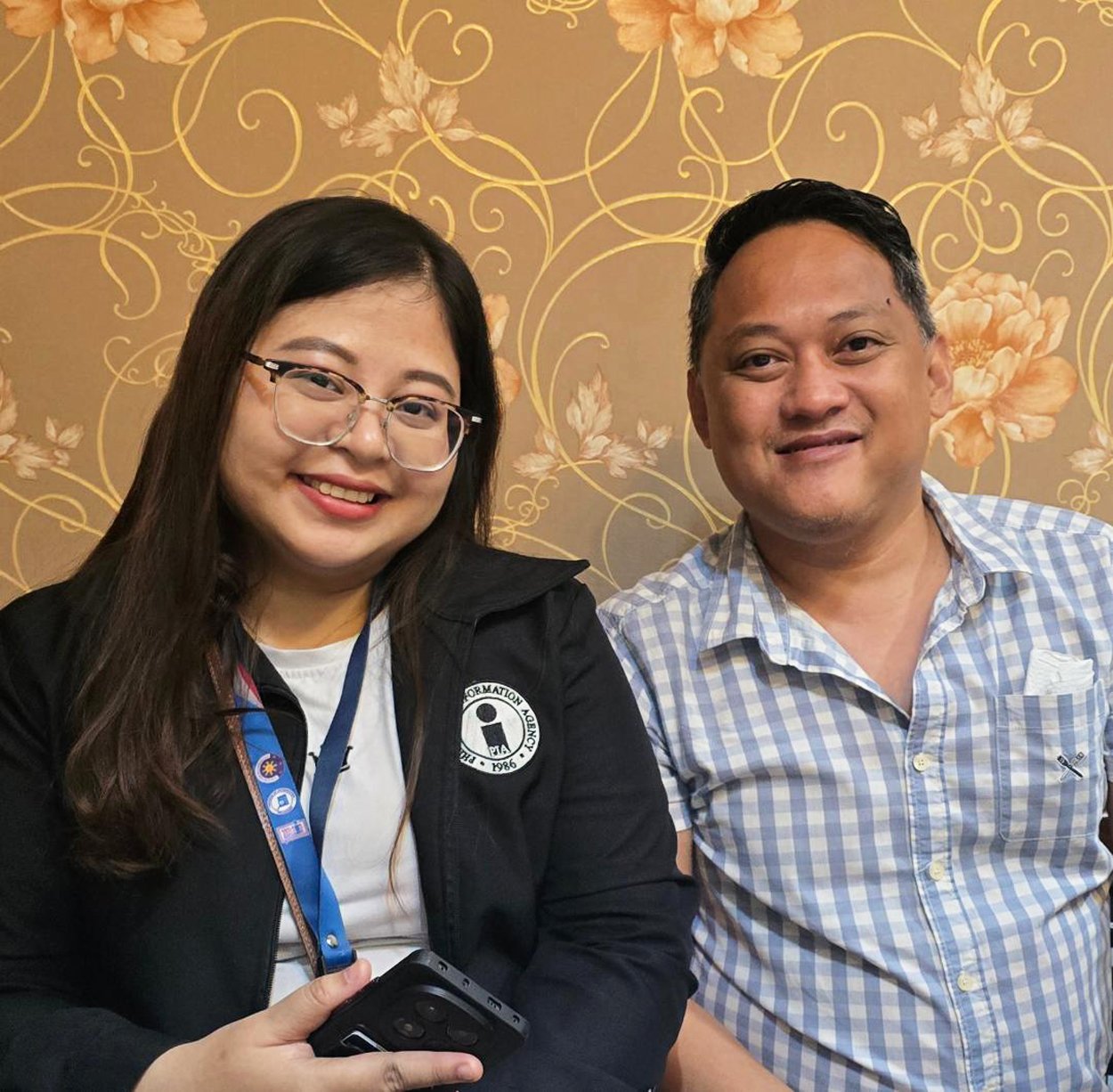 Zowanna Rose Lopez of the Philippine Information Agency Region 7 with Robby Alugar, RMA News president.