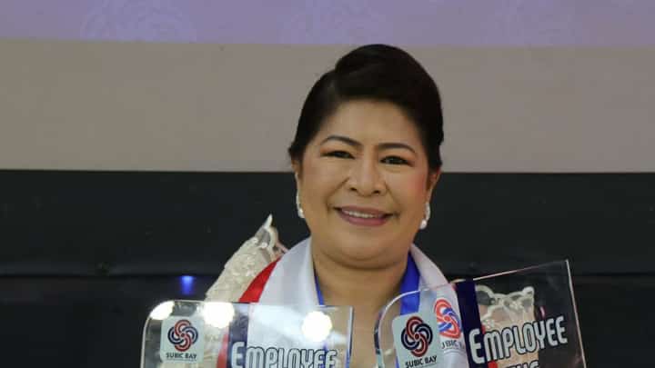 Subic Bay Metropolitan Authority (SBMA) Employee of the Year 2024-Category 2, Dr. Arlene G. Cesa shows off the trophies she received at the awards ceremony held at the Subic Bay Exhibition and Convention Center on November 17, 2025. One trophy is for being the EOY of the Support Services Group, and another is for being the EOY of the SBMA.