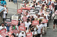 Anti-corruption march Progressive and faith-based groups parade through the Ortigas Central Business District on Sunday to call for an end to corruption and political dynasties.
