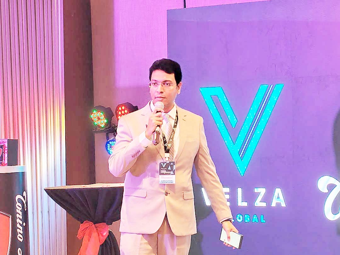 AJIT Narapareddy, CEO of Velza Global, addresses guests during the Velza Global event.