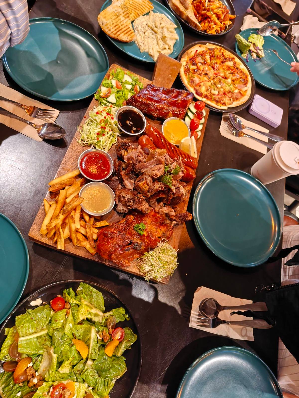 Joe’s ultimate platter with signature pasta and pizza plates.