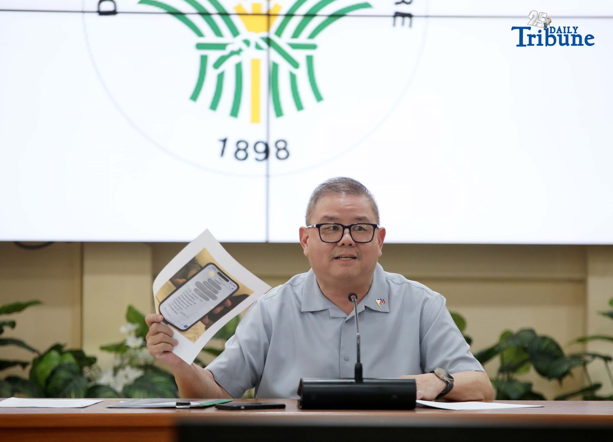 Agriculture Secretary Francisco Tiu Laurel Jr. shows a photocopy of his text exchange with former congressman Zaldy Co — along with a confidential report for Congress — in response to Co’s allegations of “price and import manipulation” of sugar, onion, rice, and fish. Tiu also denied claims that Co influenced the reduction of rice tariffs from 35 percent to 15 percent. The secretary refuted all accusations during a press conference at the Department of Agriculture office in Quezon City on Thursday. Photo by Analy Labor
