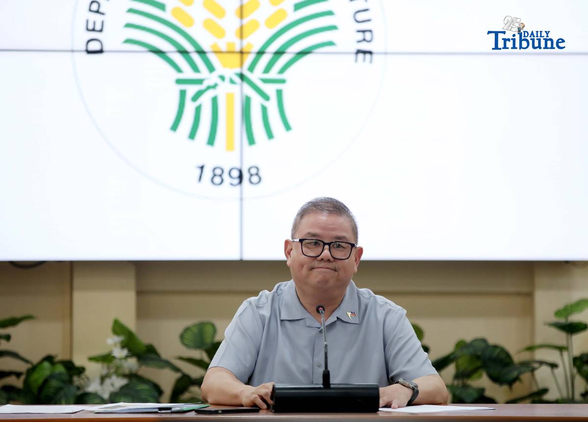 Agriculture Secretary Francisco Tiu Laurel Jr. shows a photocopy of his text exchange with former congressman Zaldy Co — along with a confidential report for Congress — in response to Co’s allegations of “price and import manipulation” of sugar, onion, rice, and fish. Tiu also denied claims that Co influenced the reduction of rice tariffs from 35 percent to 15 percent. The secretary refuted all accusations during a press conference at the Department of Agriculture office in Quezon City on Thursday. Photo by Analy Labor