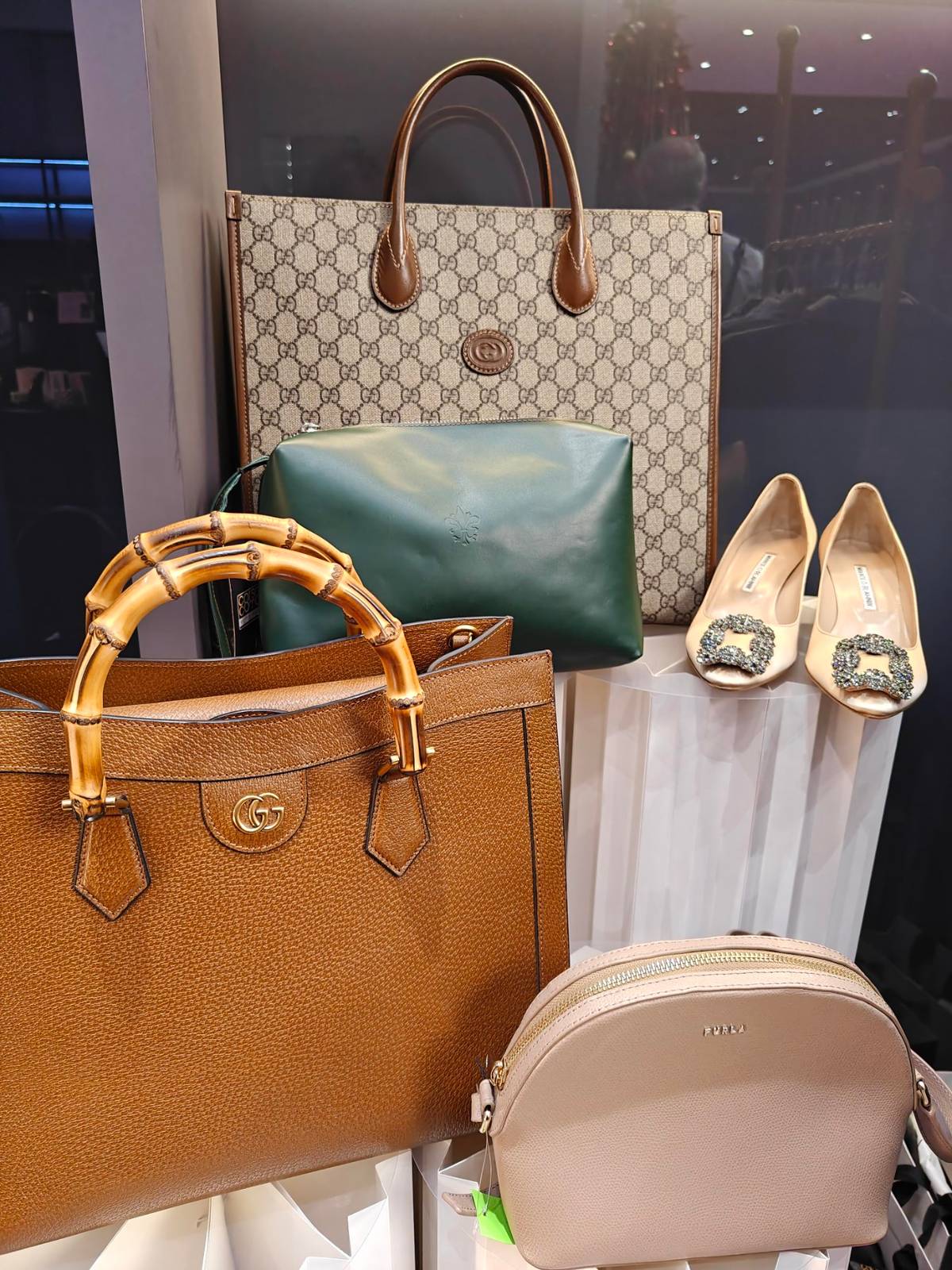 Gucci pieces and classic Manolos bring effortless elegance to the gifting lineup.