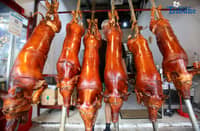 (November 28 2025) Workers arrange their freshly cooked lechon (roasted pigs) at Rix’s lechon in La Loma Quezon City the Lechon Capital of the Philippines on Friday November 28 2025.