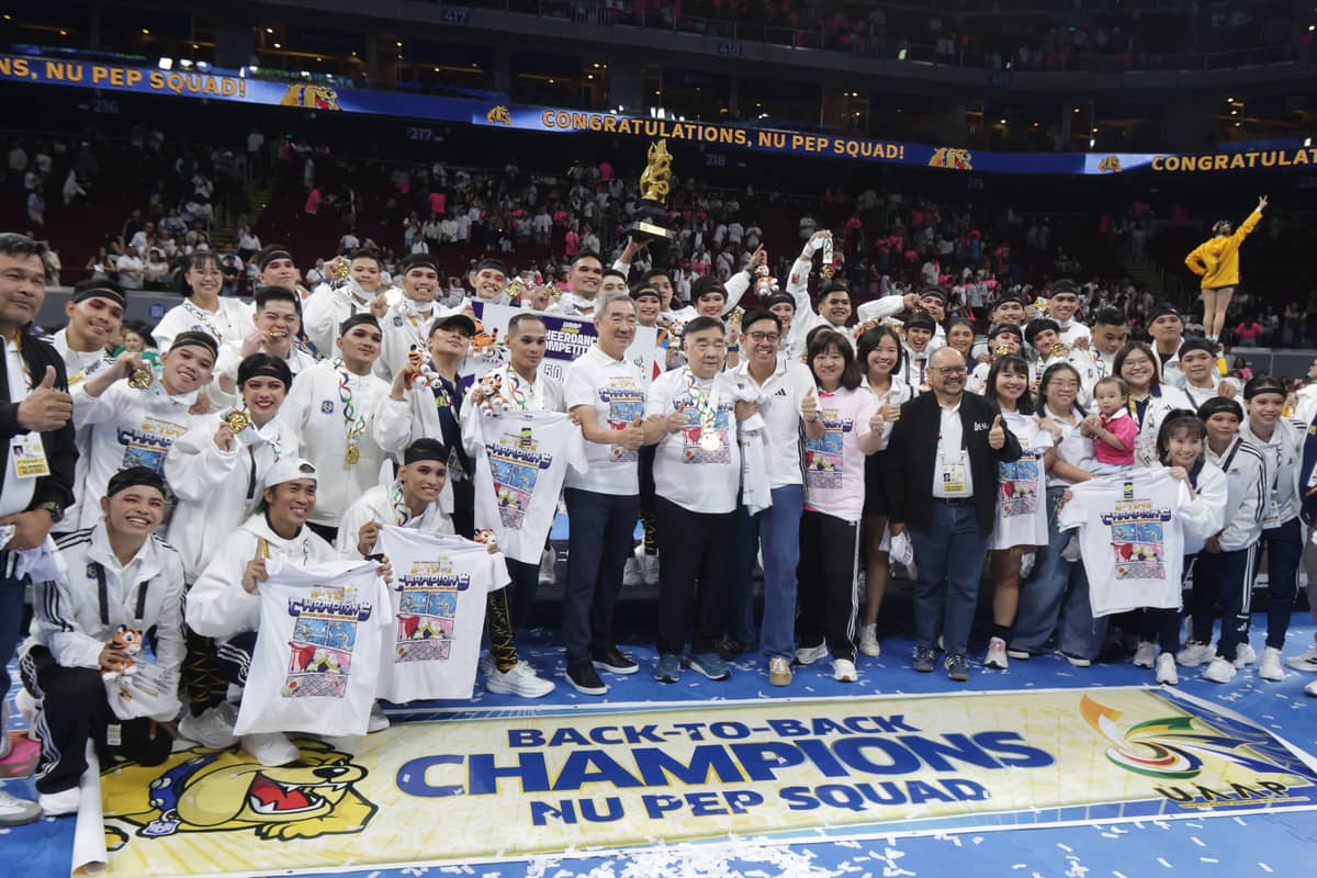 The NU Pep Squad celebrates its ninth UAAP cheerdance crown with Hans Sy after ruling Season 88 on Saturday at the Mall of Asia Arena.