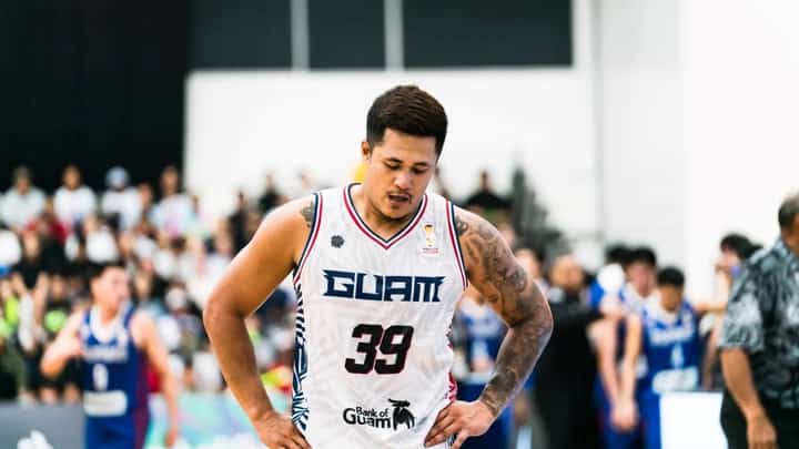 Jericho Cruz of Guam struggles to get past Scottie Thompson of Gilas Pilipinas during their FIBA World Cup Asian Qualifier game late Friday in Guam.