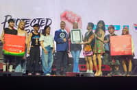 Denise van Dijk, president and chief executive officer of DKT Health Inc.; Joweeh B. Liao, director for the Health Business Unit, Finance, and Property Development at Watsons Philippines; and members of LGBTIQ+ organization UP Babaylan receive the plaque from Justin Patterson, an adjudicator from the Guinness World Records, for achieving the largest condom donation in one hour.