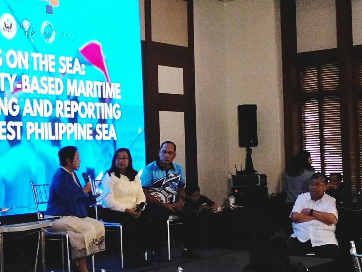 Dr. Mary Kristerie Baleva (left), Non-Resident Fellow of the Stratbase ADR Institute, moderates the “Social and Resource Protection” panel at the #WestPhilippineSea conference. Panelists include Maria Corazon Ebarvia - PEMSEA consultant (second to left), Edwin Galicia - Palawan United Commercial Fisherfolk Association (right, onstage)), and Dr. Ben Malayang III - Silliman University/UP Los Baños (far right, offstage).