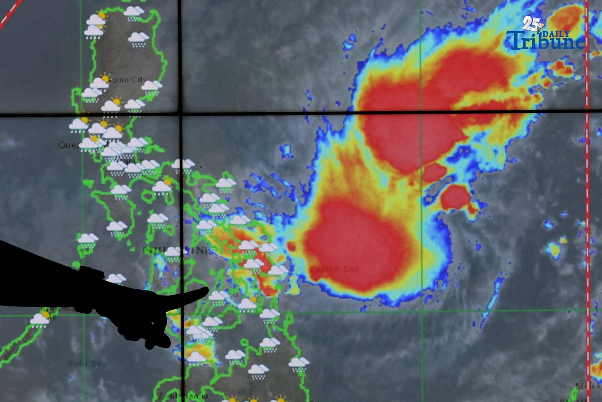 PAGASA hydro forecaster Edgar Dela Cruz points to the location of a low-pressure area east of Eastern Visayas that has developed into a tropical depression named “Wilma,” the state weather bureau announced on Thursday.