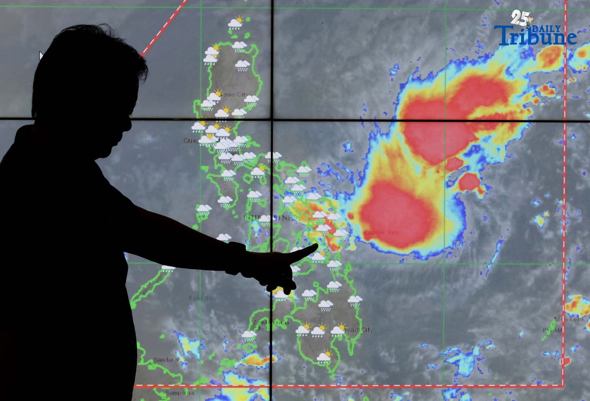 PAGASA hydro forecaster Edgar Dela Cruz points to the location of a low-pressure area east of Eastern Visayas that has developed into a tropical depression named “Wilma,” the state weather bureau announced on Thursday.